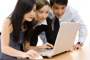 Chinese People working with Laptop